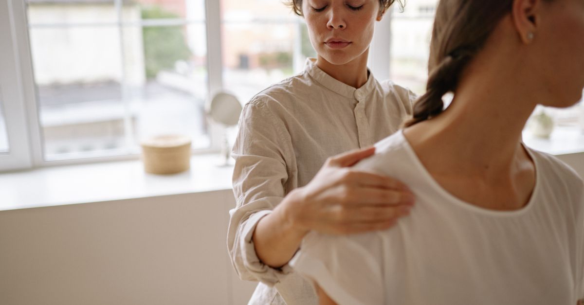 Physical therapist assessing a patient's mobility during a treatment session